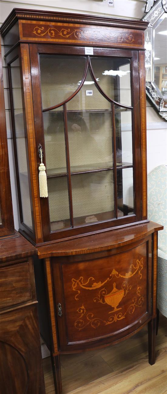 An Edwardian marquetry inlaid bowfront china display cabinet, the base enclosed by panelled door on square W.66cm